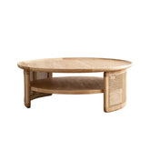 Round Japandi coffee table with solid wood top and rattan base, featuring two tiers for storage